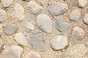cobblestones, stones frozen with cemet. Background of stones and cobblestones. Brutal background
