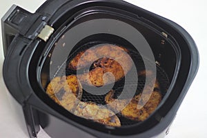 Cobia fish inside the air fryer. In India it is called Moda fish photo