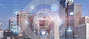 Cobol. Common Business Oriented Language. Computer programming language designed for business use. City background