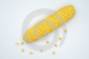 cobs of yellow corn on a white background