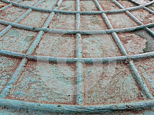 Cobweb pattern on the metal hatch.