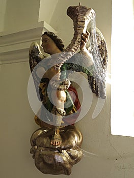 Cobwebbed sculpture of angel in church