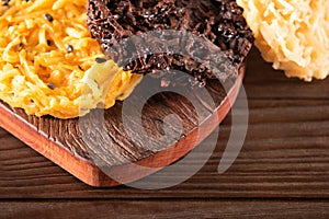 Cocada Coconut Candy on Rustic Wood Background