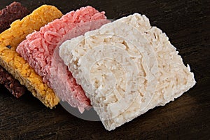 Cocada coconut candy, sweet Brazilian in background with rustic wood
