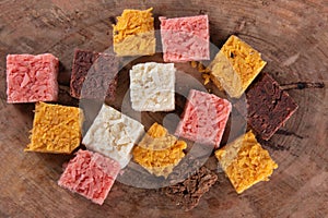 Cocada coconut candy, sweet Brazilian in background with rustic wood