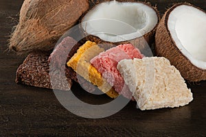 Cocada coconut candy, sweet Brazilian in rustic wood background