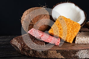 Cocada coconut candy, sweet Brazilian in rustic wood background