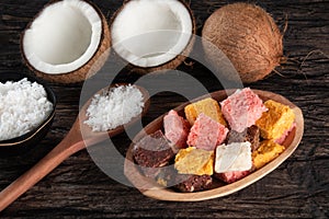 Cocada coconut candy, sweet Brazilian in rustic wood background