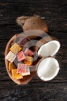 Cocada coconut candy, sweet Brazilian in rustic wood background