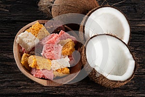 Cocada coconut candy, sweet Brazilian in rustic wood background