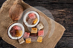 Cocada coconut candy, sweet Brazilian in rustic wood background