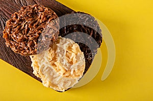 Cocada Coconut Candy on Yellow Background top view