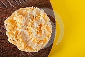 Cocada Coconut Candy on Yellow Background top view