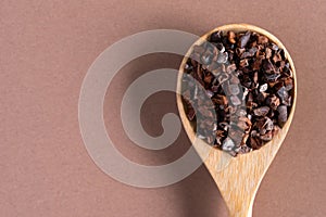 Cocao Nibs on a Wood Spoon