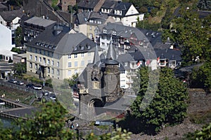 Cochem, Germany - 09 17 2020: Gate of Reichsburg Cochem with the Mosel waterfront street