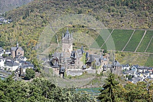 Cochem, Germany - 09 17 2020: Reichsburg above Cochem with vineyards in background