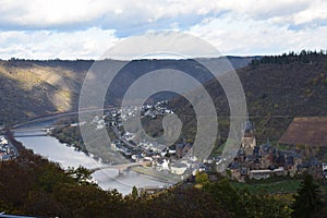 Cochem, Germany - 11 17 2020: view from the Eifel across Reichsburg and Cochem with both bridges inn autumn