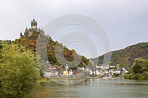 Cochem in Germany -  city view with Reichsburg castle on a hill in autumn color