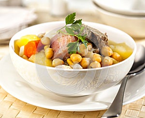 Cocido is a traditional Spanish stew photo
