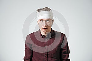 Man with bandage on his head photo