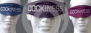 Cockiness can blind our views and limit perspective - pictured as word Cockiness on eyes to symbolize that Cockiness can distort