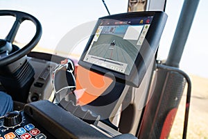 Cockpit of autonomous tractor working on the field. Smart farming