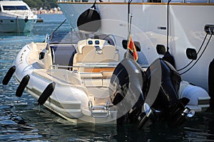 Cockpit boat moored near the luxury motor yacht