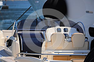 Cockpit boat moored near the luxury motor yacht