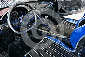 Cockpit of junkyard masterwork replica of Bugatti Chiron sport car made of scrap metal