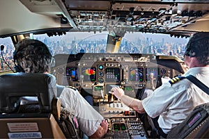 The cockpit of a modern passenger aircraft in flight. Pilots at work