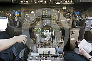 Cockpit and pilots getting ready to start flying