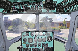 The cockpit of a Russian helicopter with control devices the names of the devices are written in Russian