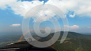 Cockpit view of aircraft flying below clouds, pilots view from an airplane, light sport airplane