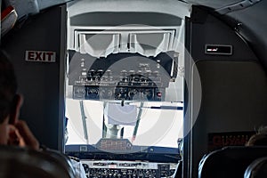 Cockpit view of Beechcraft 1900D in flight from passanger seat