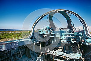 Cockpit of wrecked military aircraft. Blisters are broken