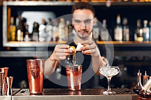 Cocktail Bar. Bartender Making Cocktails At Bar Counter