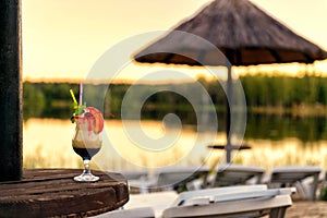 Cocktail on the beach at sunset