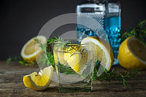 Cocktail with blue gin , tonic and lemon