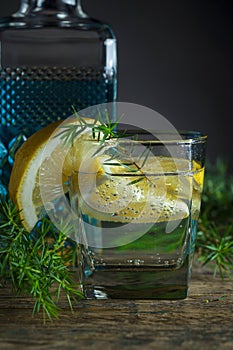 Cocktail with blue gin , tonic and lemon