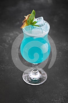 Cocktail Blue Lagoon without entourage on a dark background