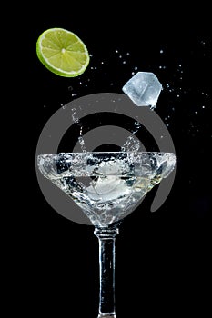Cocktail in a cocktail glass on a black background