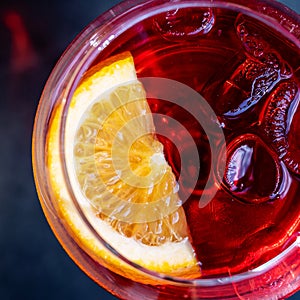 Cocktail dring in a glass with slice of orange and ice