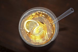 Cocktail drink with lemon silice golden yellow liquid photo