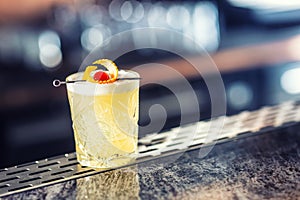 Cocktail drink whiskey sour at barcounter in night club or restaurant