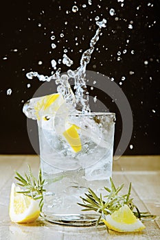 Cocktail with gin and tonic. Splashing photo