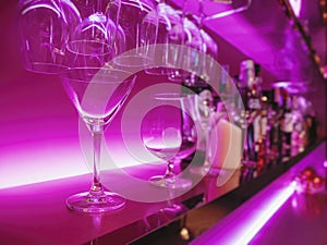 Cocktail Glass on Bar shelf drink Party nightclub blur background