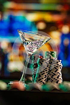 Cocktail glass on the casino gambling table