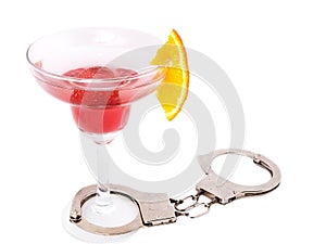 Cocktail glass with handcuffs