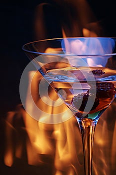 Cocktail glass over fire trace