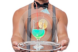A cocktail glass on a tray in the hands of of the waiter